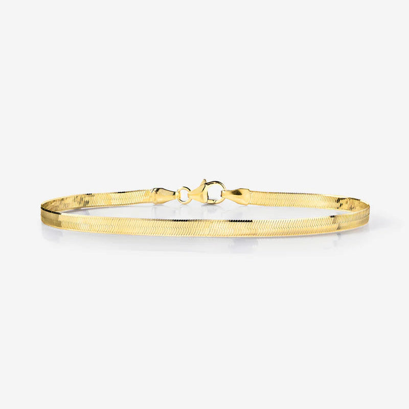 Gold bracelet on a white background